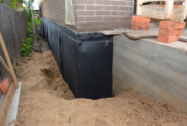 Happy homeowners after waterproofing job in Long Beach